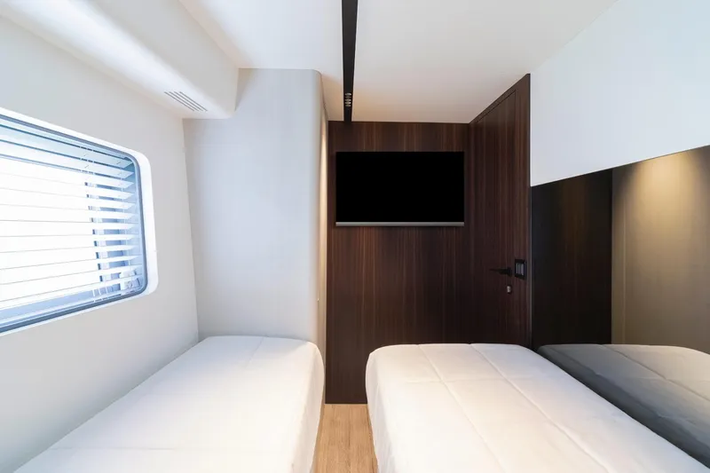 As 5 Yacht Photos Pics Interior of 2026 Astondoa AS 5 yacht cabin with twin beds and TV.