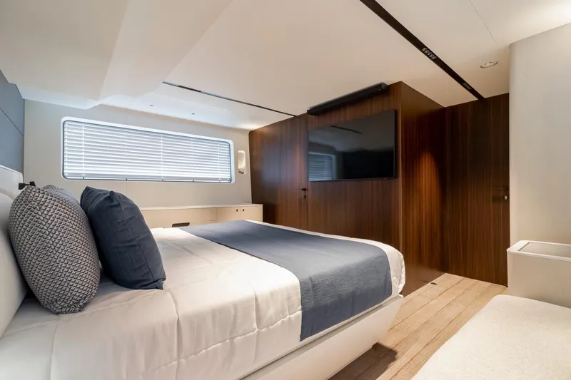 As 5 Yacht Photos Pics Luxurious bedroom interior of 2026 Astondoa AS 5 yacht with modern design and wood accents.