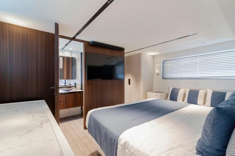 As 5 Yacht Photos Pics Luxurious bedroom interior of 2026 Astondoa AS 5 yacht with modern design and elegant furnishings.