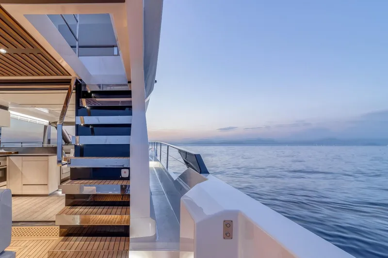 As 5 Yacht Photos Pics Luxurious 2026 Astondoa AS 5 yacht interior with ocean view at sunset.