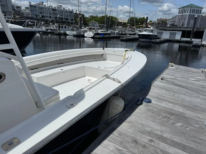 Yacht Photos Pics 2014 Regulator 34 Center Console boat docked at a marina.
