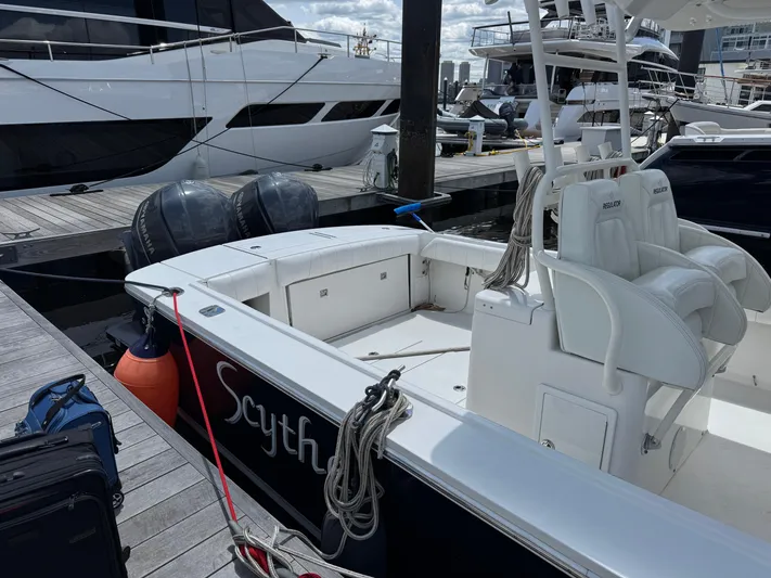  Yacht Photos Pics 2014 Regulator 34 Center Console boat docked at marina with visible seating and equipment.