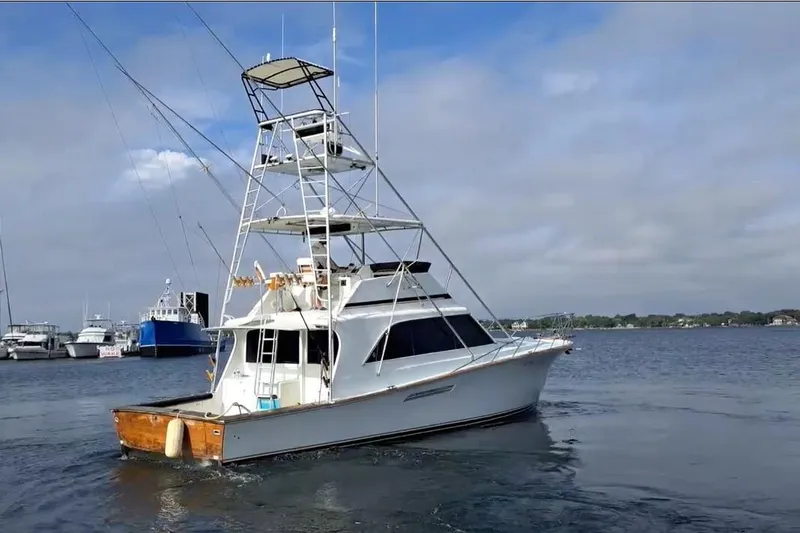 Nobody Yacht Photos Pics 1988 Ocean Yachts 48 Super Sport boat on calm water, featuring a tall tower.
