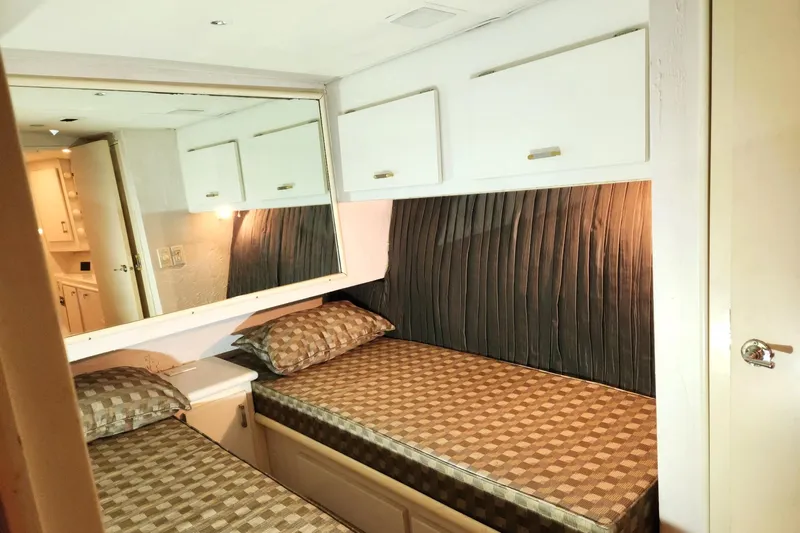 Nobody Yacht Photos Pics 1988 Ocean Yachts 48 Super Sport cabin with twin beds and storage cabinets.