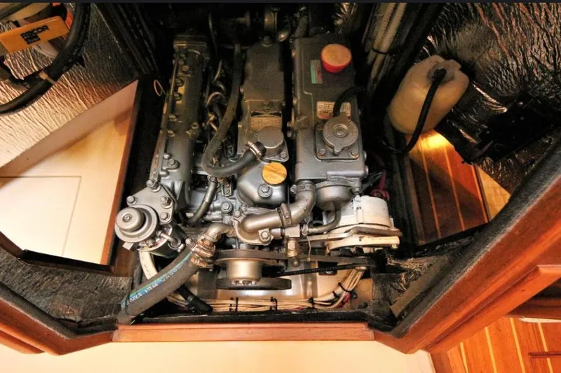 Lastochka Yacht Photos Pics Engine compartment of a 2000 Island Packet 420 sailboat, showcasing detailed mechanical components.