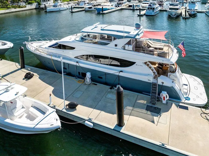  Yacht Photos Pics 2013 Hatteras 80 Motor Yacht docked at marina, featuring spacious deck and sleek design.