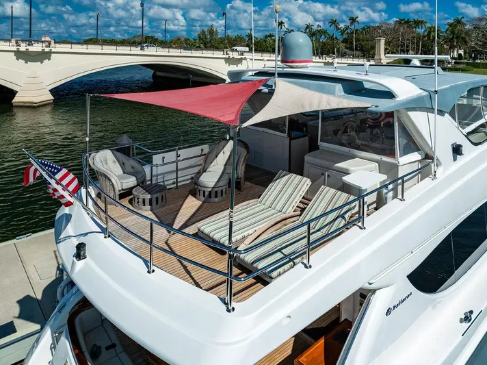  Yacht Photos Pics 2013 Hatteras 80 Motor Yacht with sun deck, lounge chairs, and bridge view.