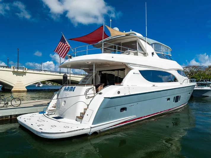  Yacht Photos Pics 2013 Hatteras 80 Motor Yacht docked, featuring sleek design and American flag.