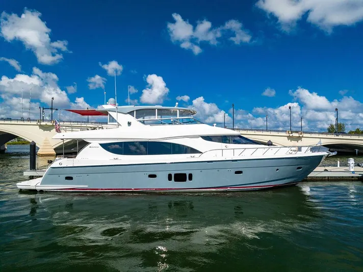  Yacht Photos Pics 2013 Hatteras 80 Motor Yacht docked under a clear blue sky.