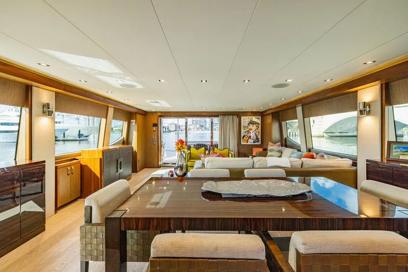  Yacht Photos Pics Luxurious interior of 2013 Hatteras 80 Motor Yacht with elegant dining area and panoramic windows.