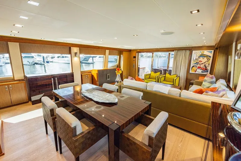  Yacht Photos Pics Luxurious interior of 2013 Hatteras 80 Motor Yacht with elegant dining and seating area.