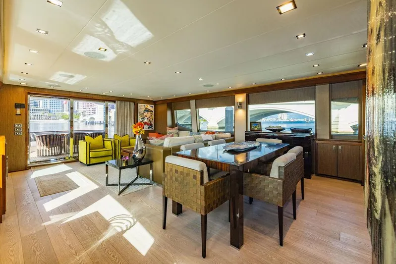  Yacht Photos Pics Luxurious interior of 2013 Hatteras 80 Motor Yacht with modern furnishings and large windows.