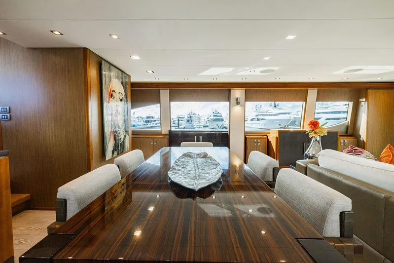  Yacht Photos Pics Luxurious interior of 2013 Hatteras 80 Motor Yacht with elegant dining area.