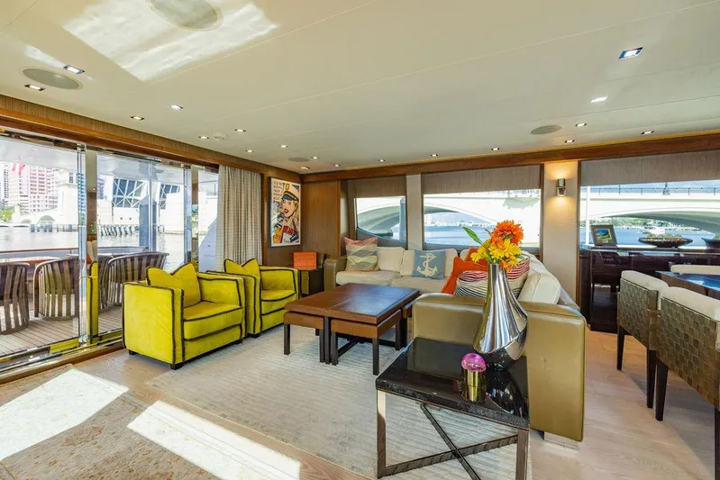  Yacht Photos Pics Luxurious interior of 2013 Hatteras 80 Motor Yacht with modern furnishings and vibrant decor.