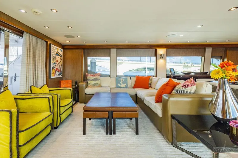  Yacht Photos Pics Luxurious interior of 2013 Hatteras 80 Motor Yacht with vibrant seating and elegant decor.