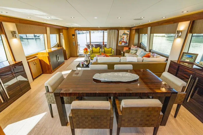  Yacht Photos Pics Luxurious interior of 2013 Hatteras 80 Motor Yacht with elegant dining and seating area.