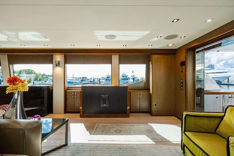  Yacht Photos Pics Luxurious interior of 2013 Hatteras 80 Motor Yacht with elegant furnishings and large windows.