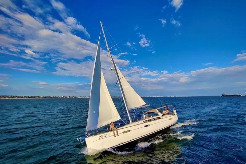 La Bella Vita Yacht Photos Pics 2015 Beneteau Oceanis 45 sailing on open sea under clear blue skies.