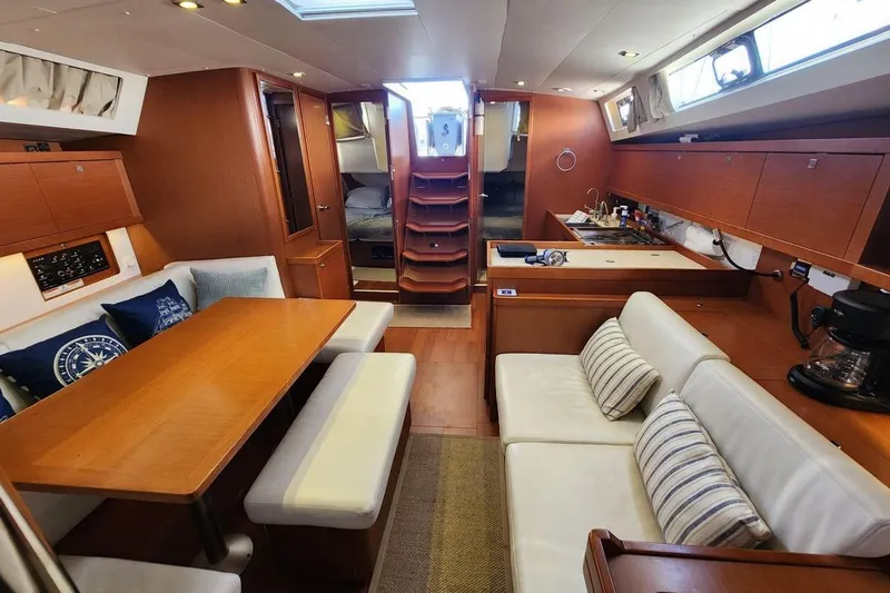 La Bella Vita Yacht Photos Pics Interior of 2015 Beneteau Oceanis 45 yacht with cozy seating and modern kitchen.