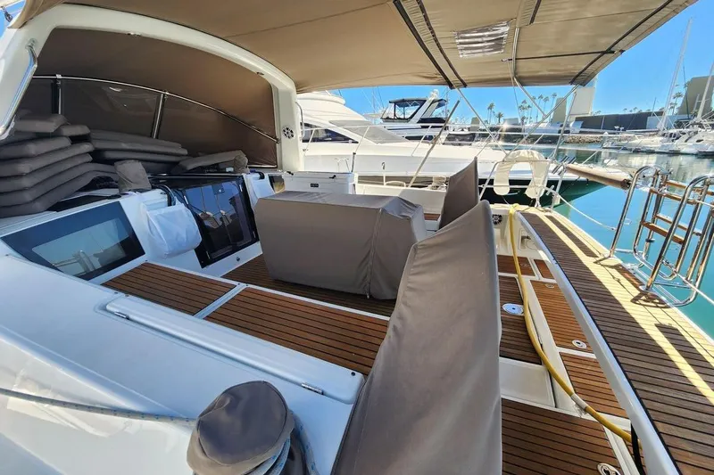 La Bella Vita Yacht Photos Pics 2015 Beneteau Oceanis 45 yacht with spacious deck and seating area in marina.