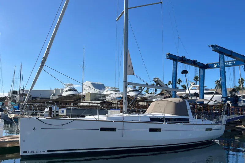 La Bella Vita Yacht Photos Pics 2015 Beneteau Oceanis 45 sailboat docked at marina under clear blue sky.