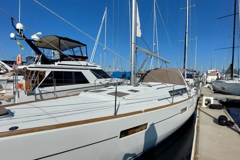 La Bella Vita Yacht Photos Pics 2015 Beneteau Oceanis 45 sailboat docked at marina under clear blue sky.