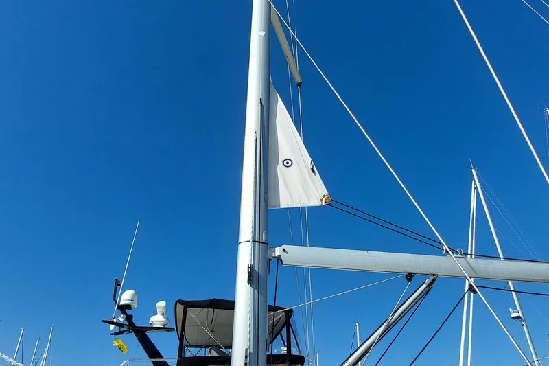 La Bella Vita Yacht Photos Pics Sailboat mast and rigging of 2015 Beneteau Oceanis 45 against clear blue sky.