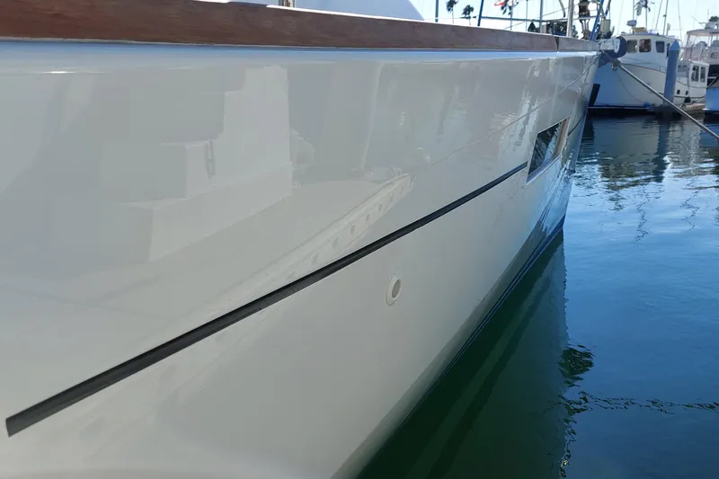 La Bella Vita Yacht Photos Pics 2015 Beneteau Oceanis 45 yacht side view, docked in a marina.
