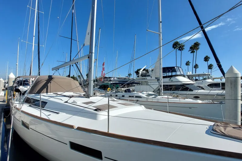 La Bella Vita Yacht Photos Pics 2015 Beneteau Oceanis 45 sailboat docked at marina under clear blue sky.