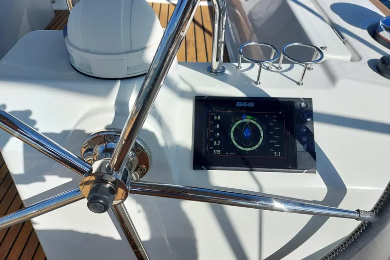 La Bella Vita Yacht Photos Pics Steering wheel and navigation display on 2015 Beneteau Oceanis 45 yacht.