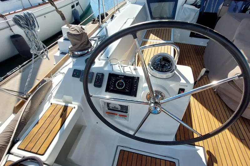 La Bella Vita Yacht Photos Pics Steering wheel and navigation instruments on 2015 Beneteau Oceanis 45 yacht deck.