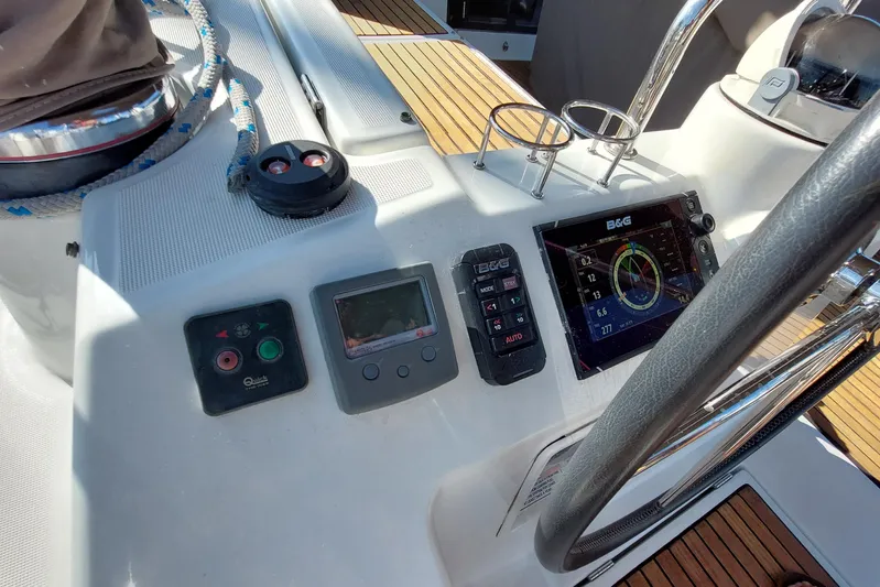 La Bella Vita Yacht Photos Pics Cockpit of 2015 Beneteau Oceanis 45 with navigation instruments and steering wheel.
