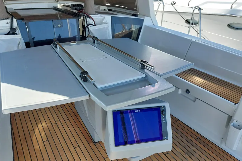 La Bella Vita Yacht Photos Pics Beneteau Oceanis 45 cockpit with navigation equipment and foldable table, 2015 model.