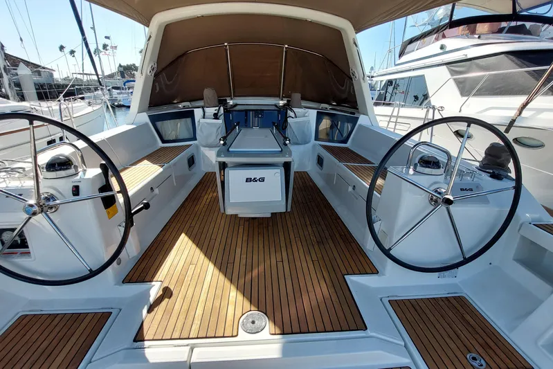 La Bella Vita Yacht Photos Pics 2015 Beneteau Oceanis 45 yacht cockpit with dual steering wheels and teak flooring.