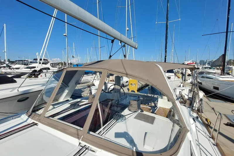 La Bella Vita Yacht Photos Pics 2015 Beneteau Oceanis 45 sailboat docked at marina under clear blue sky.