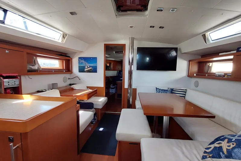 La Bella Vita Yacht Photos Pics Interior of 2015 Beneteau Oceanis 45 yacht with modern dining area and seating.