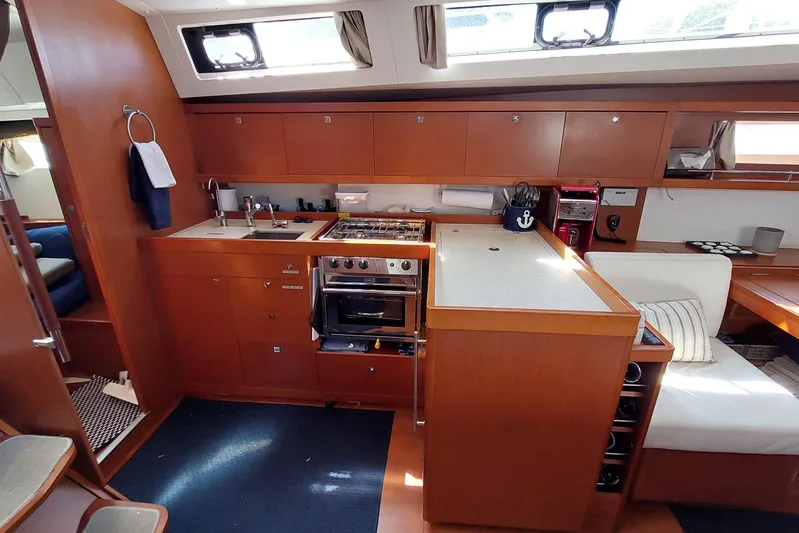 La Bella Vita Yacht Photos Pics Interior of 2015 Beneteau Oceanis 45 yacht, featuring a modern kitchen and seating area.