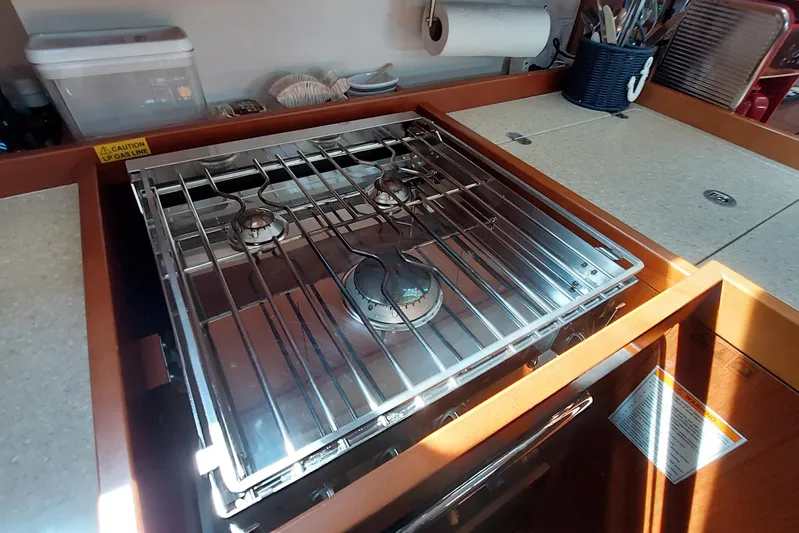 La Bella Vita Yacht Photos Pics Stove in 2015 Beneteau Oceanis 45 yacht kitchen with utensils and countertop.