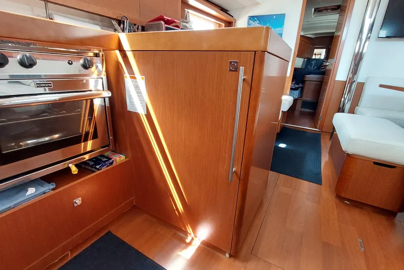 La Bella Vita Yacht Photos Pics Interior of 2015 Beneteau Oceanis 45 yacht, featuring a modern kitchen and seating area.