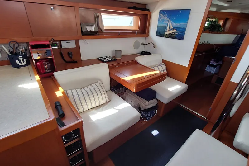 La Bella Vita Yacht Photos Pics Interior of 2015 Beneteau Oceanis 45 yacht with cozy seating and nautical decor.