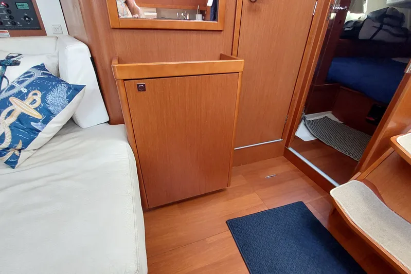 La Bella Vita Yacht Photos Pics Interior of 2015 Beneteau Oceanis 45 yacht with wooden cabinetry and nautical-themed decor.