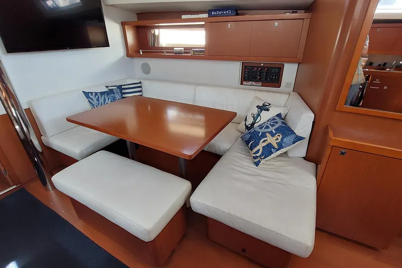 La Bella Vita Yacht Photos Pics Interior of 2015 Beneteau Oceanis 45 yacht with cozy seating and nautical decor.