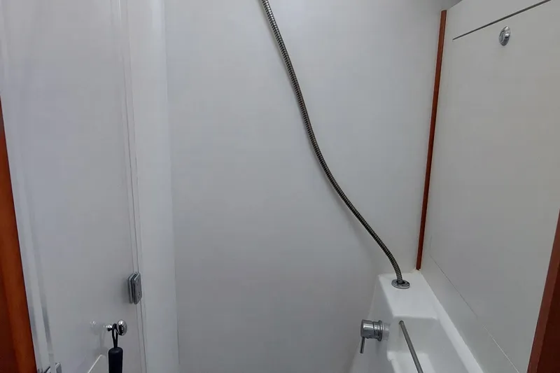 La Bella Vita Yacht Photos Pics Shower area in 2015 Beneteau Oceanis 45 yacht, featuring sleek design and modern fixtures.