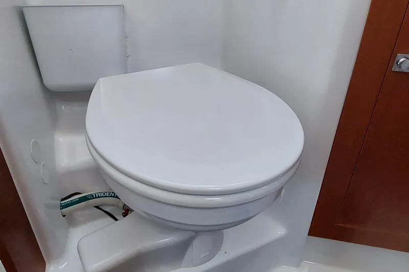 La Bella Vita Yacht Photos Pics Beneteau Oceanis 45 (2015) yacht bathroom with white marine toilet.