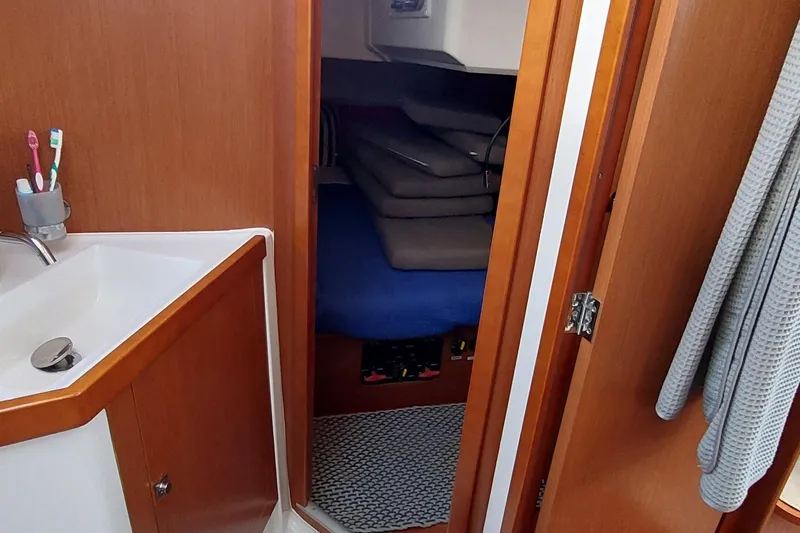 La Bella Vita Yacht Photos Pics Interior of 2015 Beneteau Oceanis 45 yacht showing bathroom and cabin entrance.