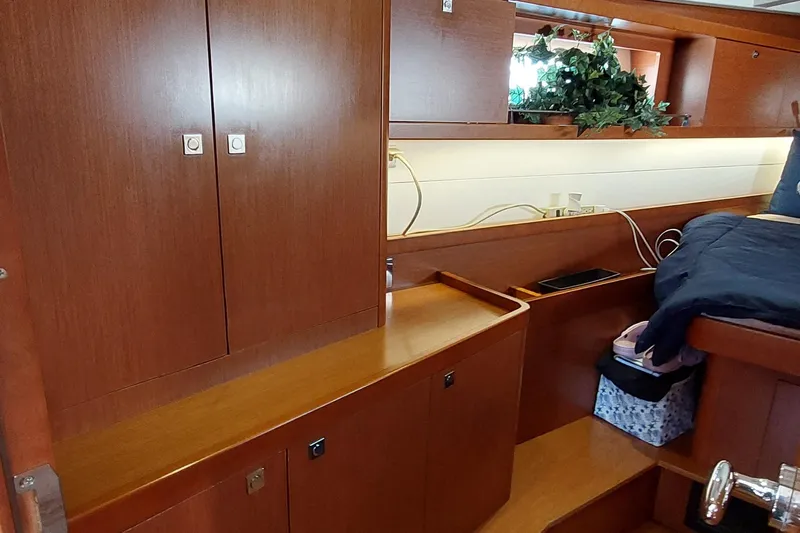 La Bella Vita Yacht Photos Pics Interior of 2015 Beneteau Oceanis 45 yacht with wooden cabinetry and cozy decor.
