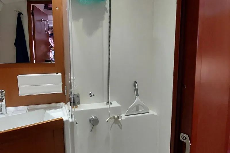 La Bella Vita Yacht Photos Pics Bathroom interior of 2015 Beneteau Oceanis 45 yacht with shower and sink.