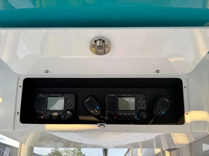  Yacht Photos Pics 2020 Onslow Bay 33 Tournament boat radio equipment in storage compartment.
