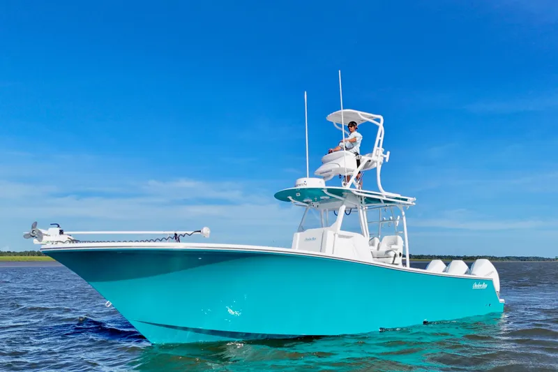  Yacht Photos Pics 2021 Onslow Bay 33 Tournament boat on water under clear blue sky.