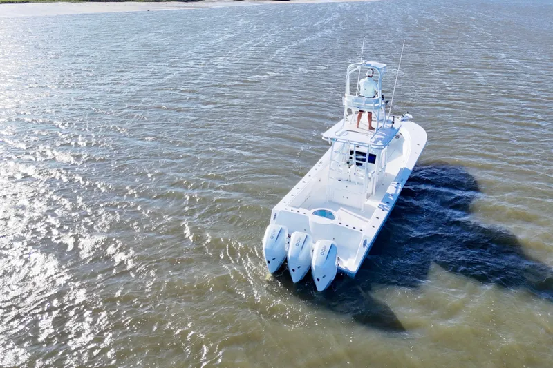  Yacht Photos Pics 2021 Onslow Bay 33 Tournament boat cruising on open water.